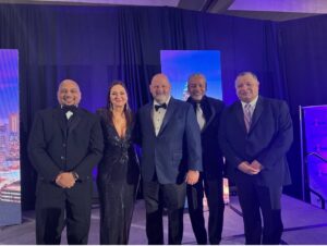 Dr. Ken Harris and Charles DeBow with Dream Exchange Executives Joe Cecala, Dwain Kyles, and Jane Hayton